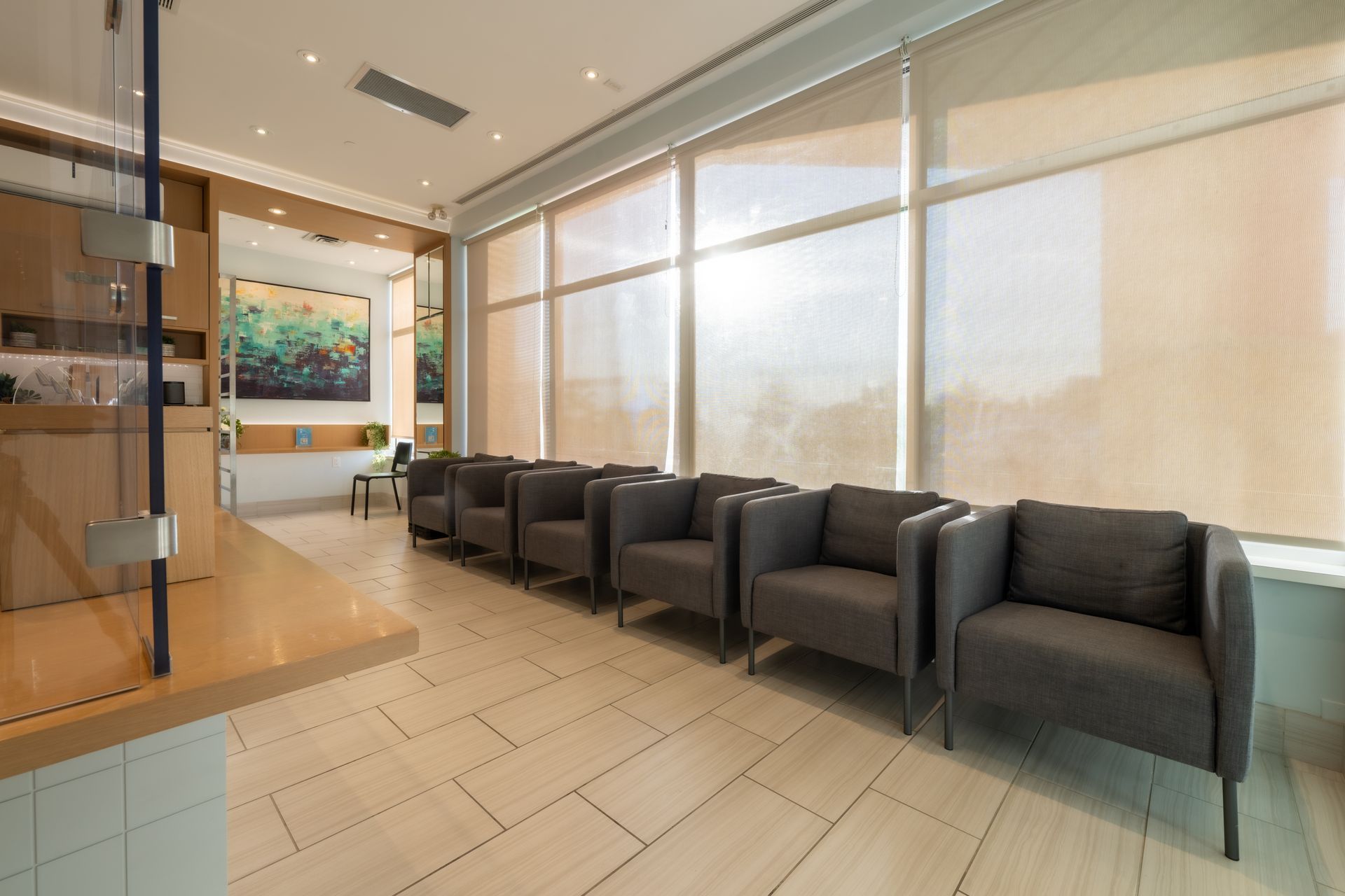 A waiting room with a lot of chairs and windows