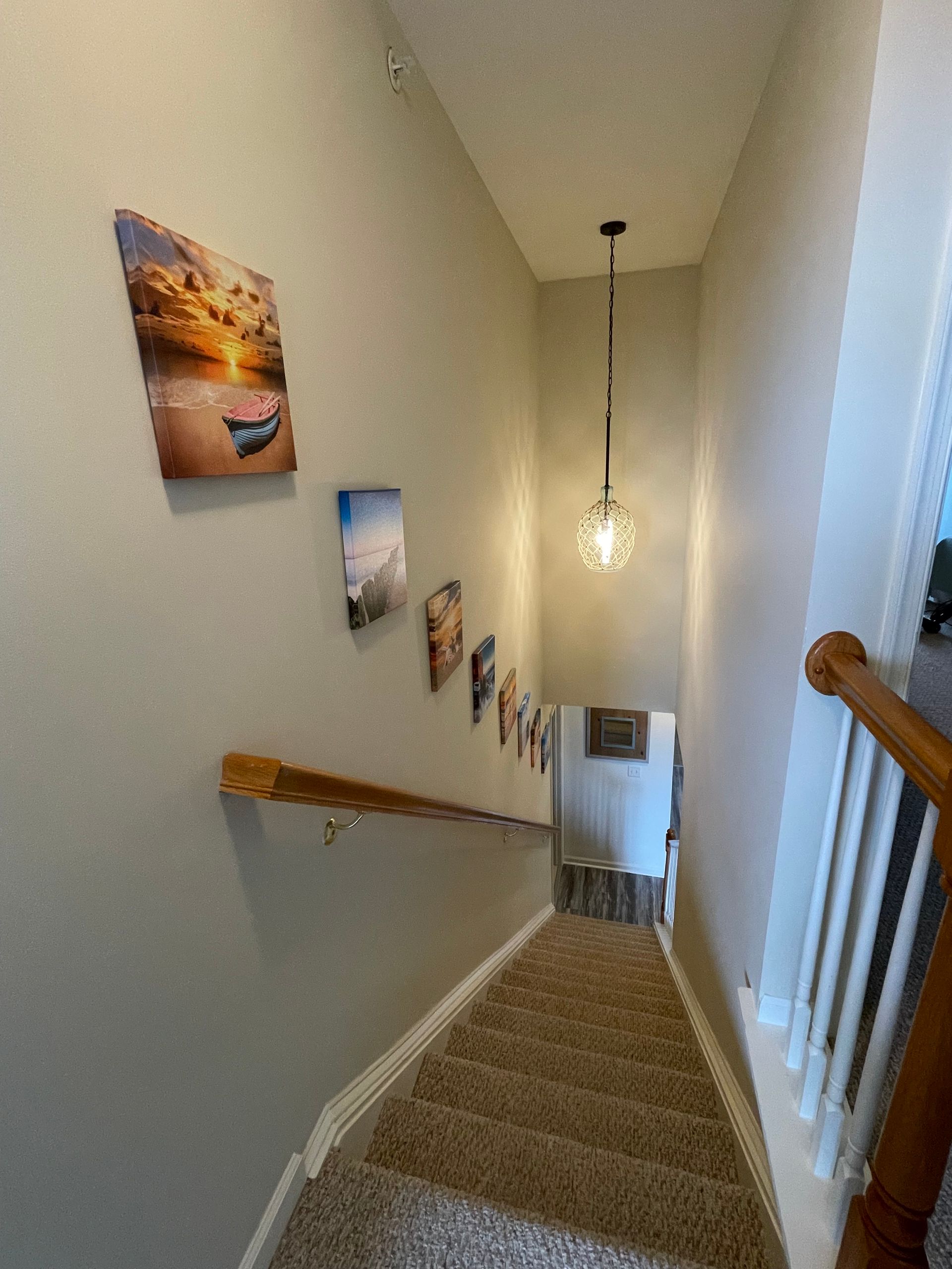 Pendant light installed in stairwell during residential electrical remodeling