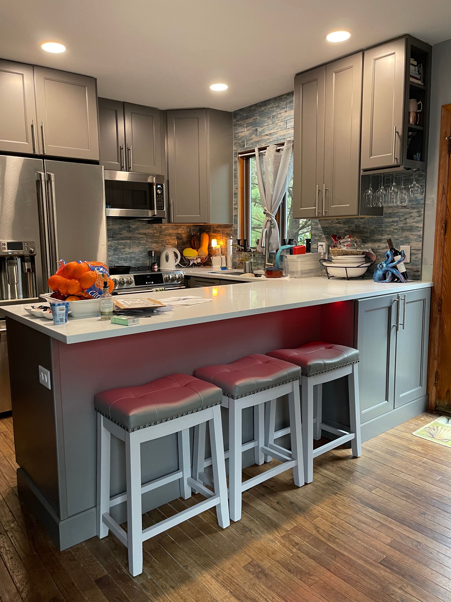 Home kitchen with recessed lighting and modern fixtures after electrical installation services