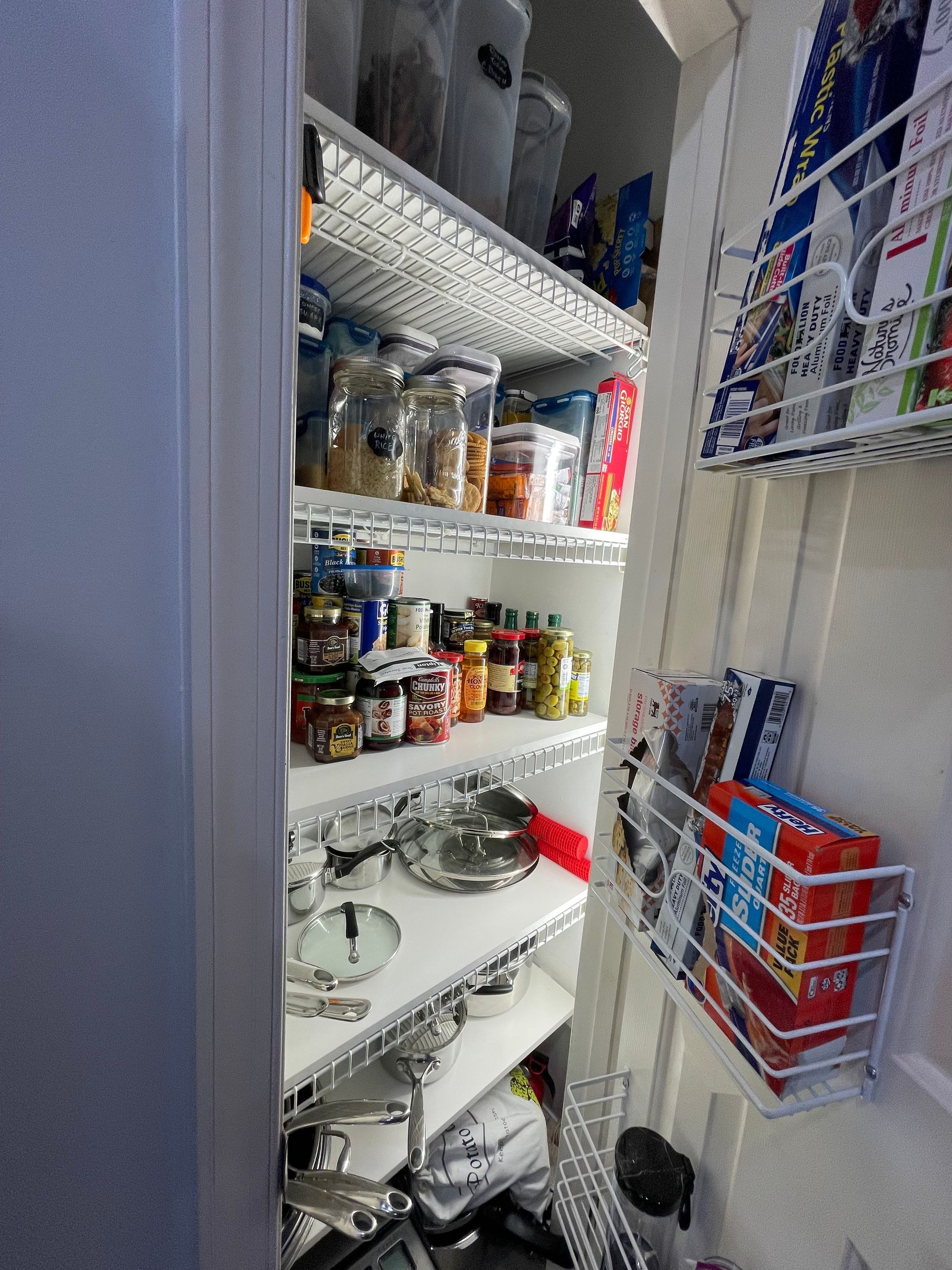 Pantry organization with custom shelving and lighting from electrical installation work