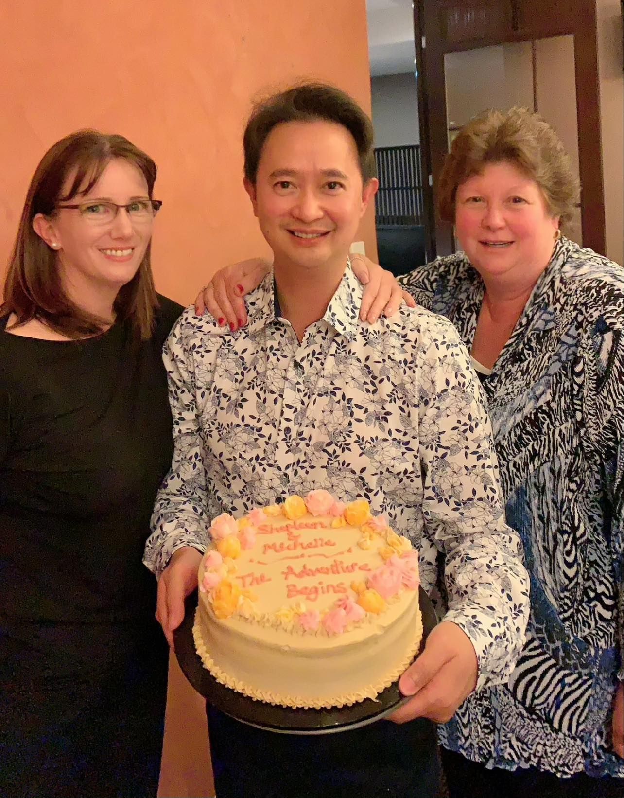 Dr. Tam Holding A Cake — Bruce ACT — Dr. Sim Hom Tam
