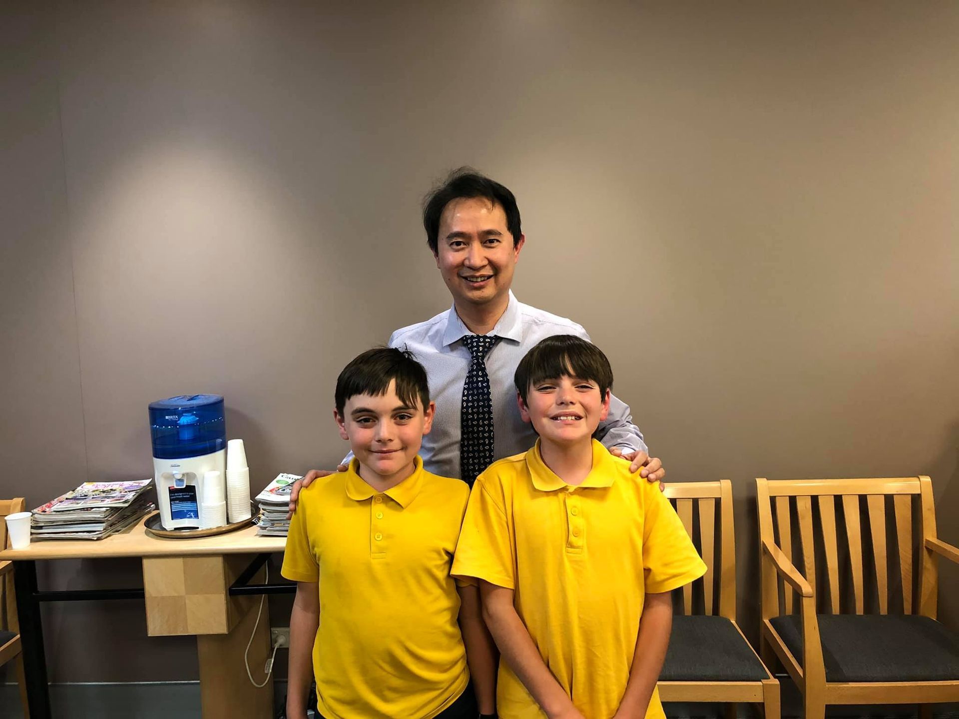 Two Kids Wearing Yellow — Bruce ACT — Dr. Sim Hom Tam