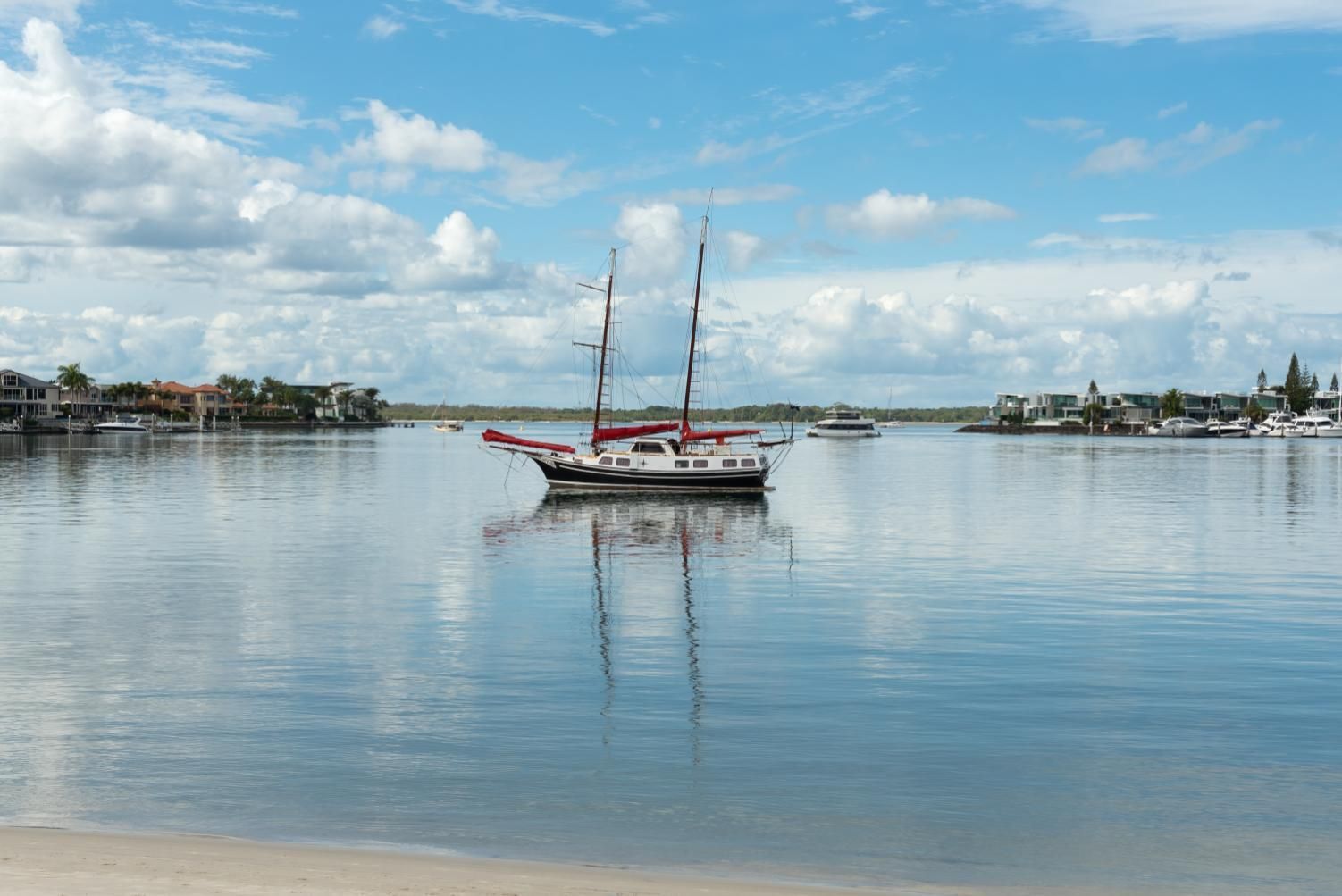Sailboat is Floating on Top of a Body of Water — Supercare Gold Coast in Paradise Point, QLD