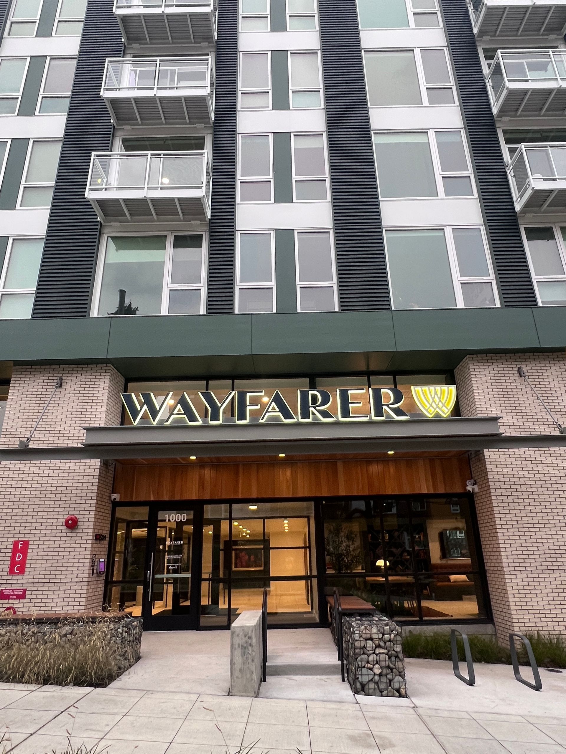 Wayfarer apartment building entrance with signage
