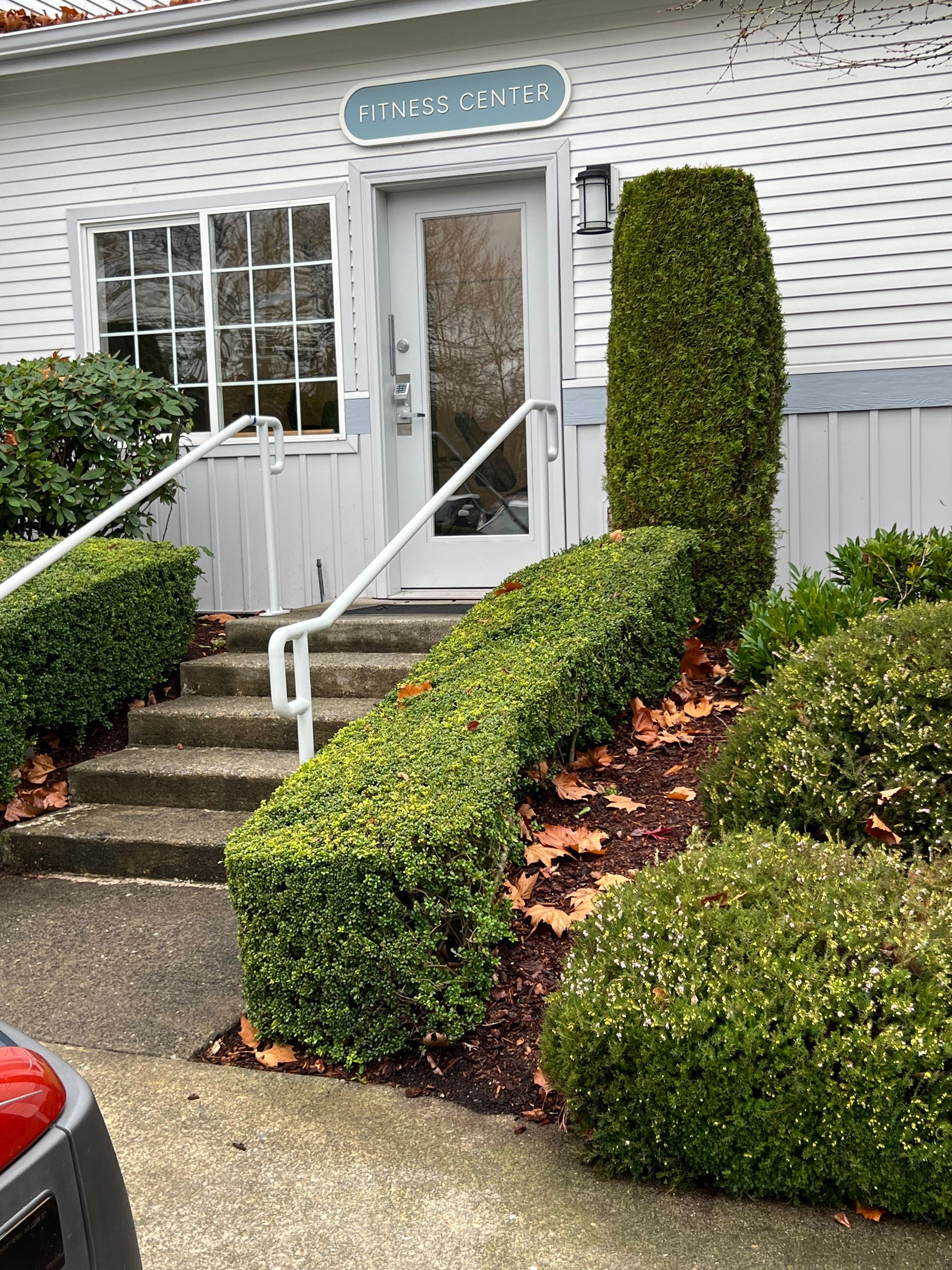 Entrance to a building with steps and a handrail