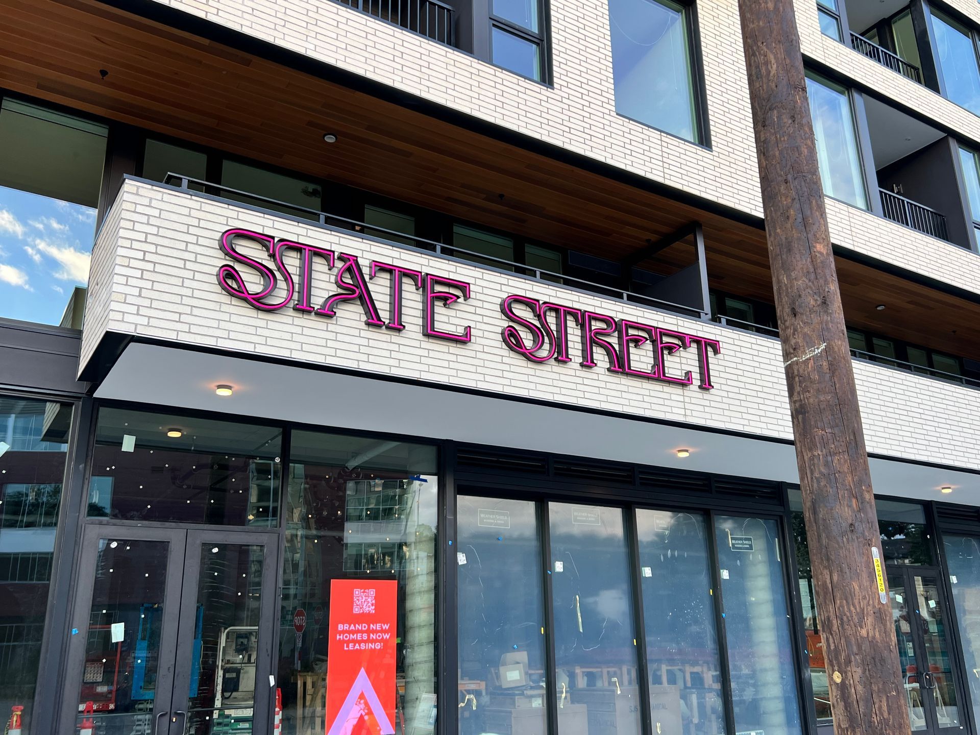 Sign above a storefront with windows
