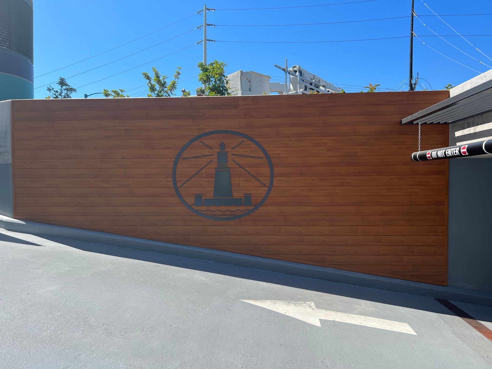 Wooden wall with a lighthouse emblem