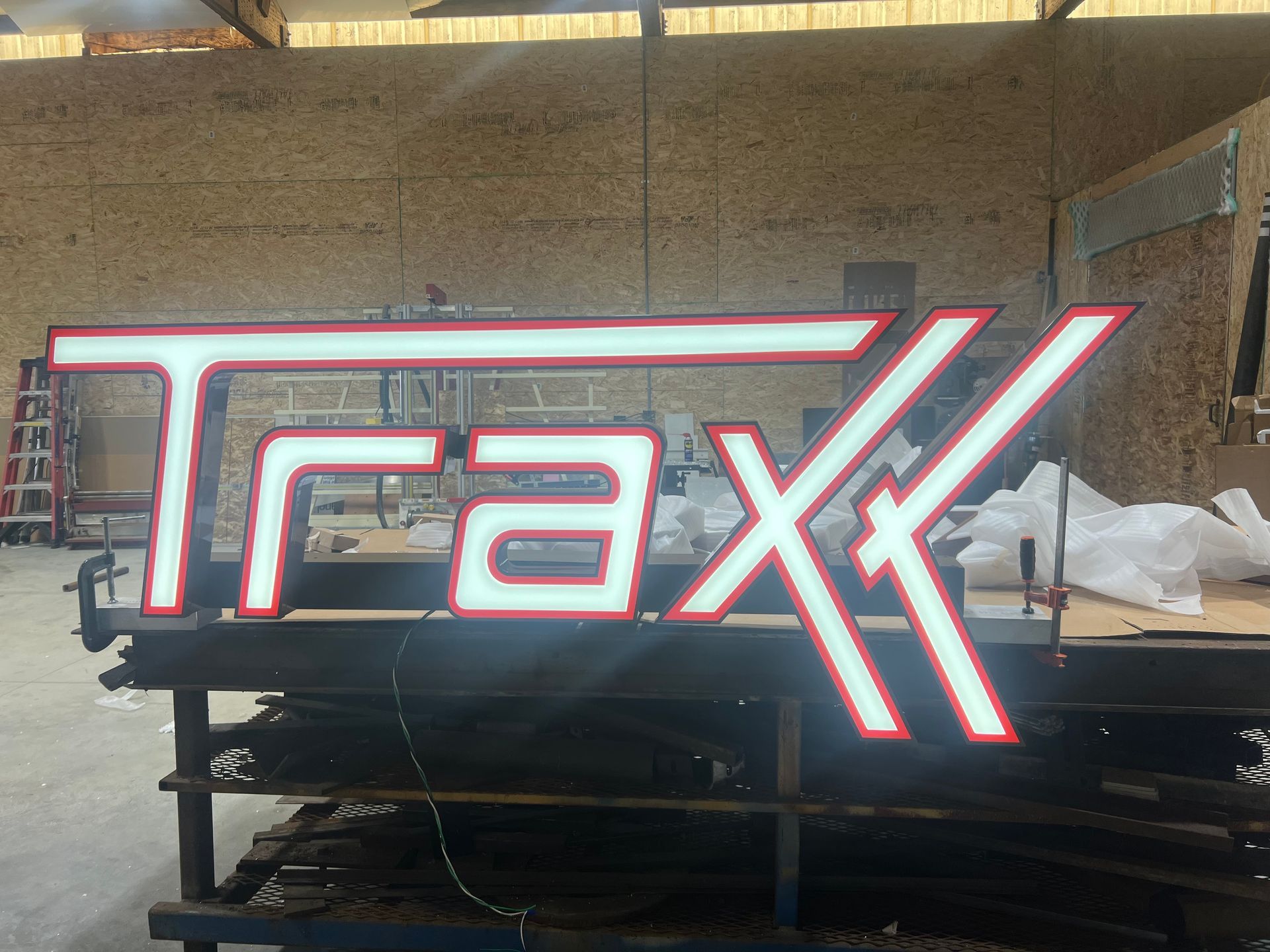 A backlit sign with white letters