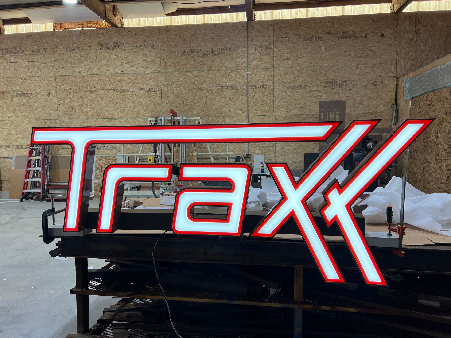 Sign with white letters and red outline