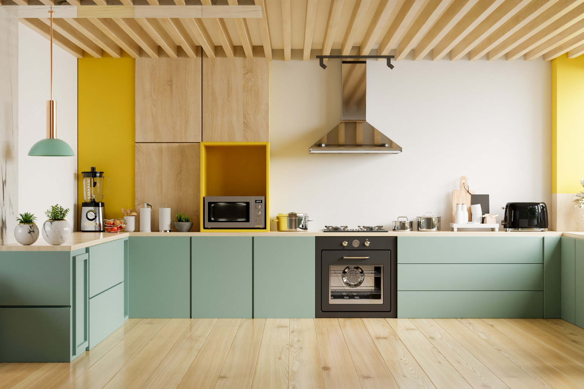 A kitchen with green cabinets , wooden floors , a stove and a microwave.