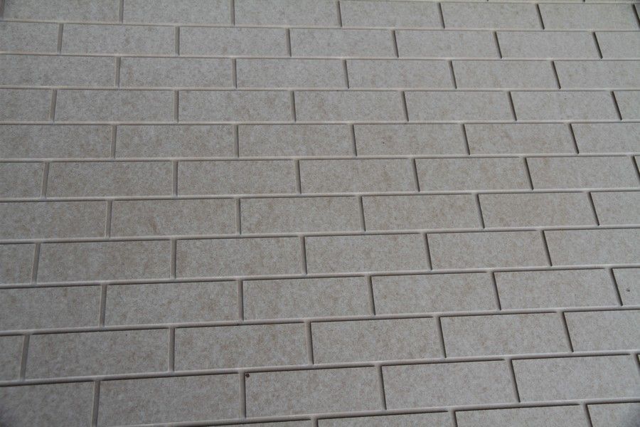 A close up of a white brick wall
