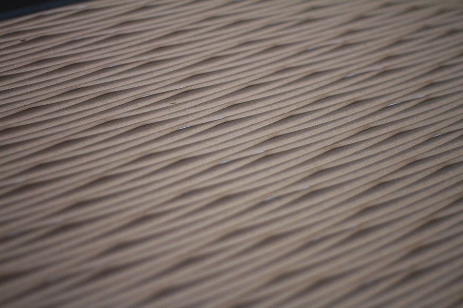 A close up of a piece of cardboard with a texture pattern on it.