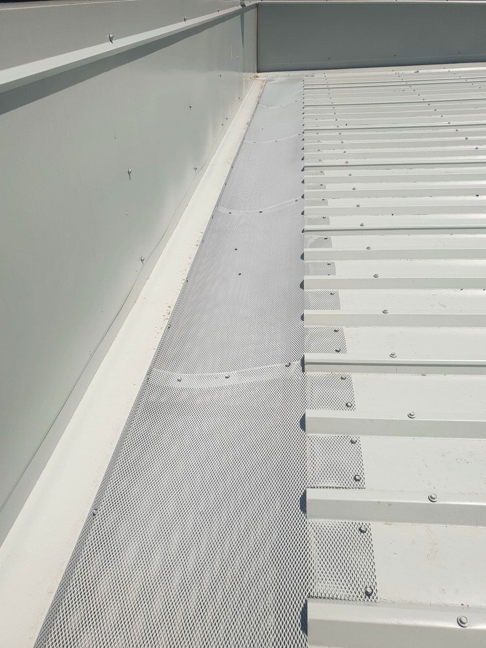 White Metal Roof with Gutter Guard and Vertical Wall — All-Clear Gutter Guard NQ in Atherton, QLD