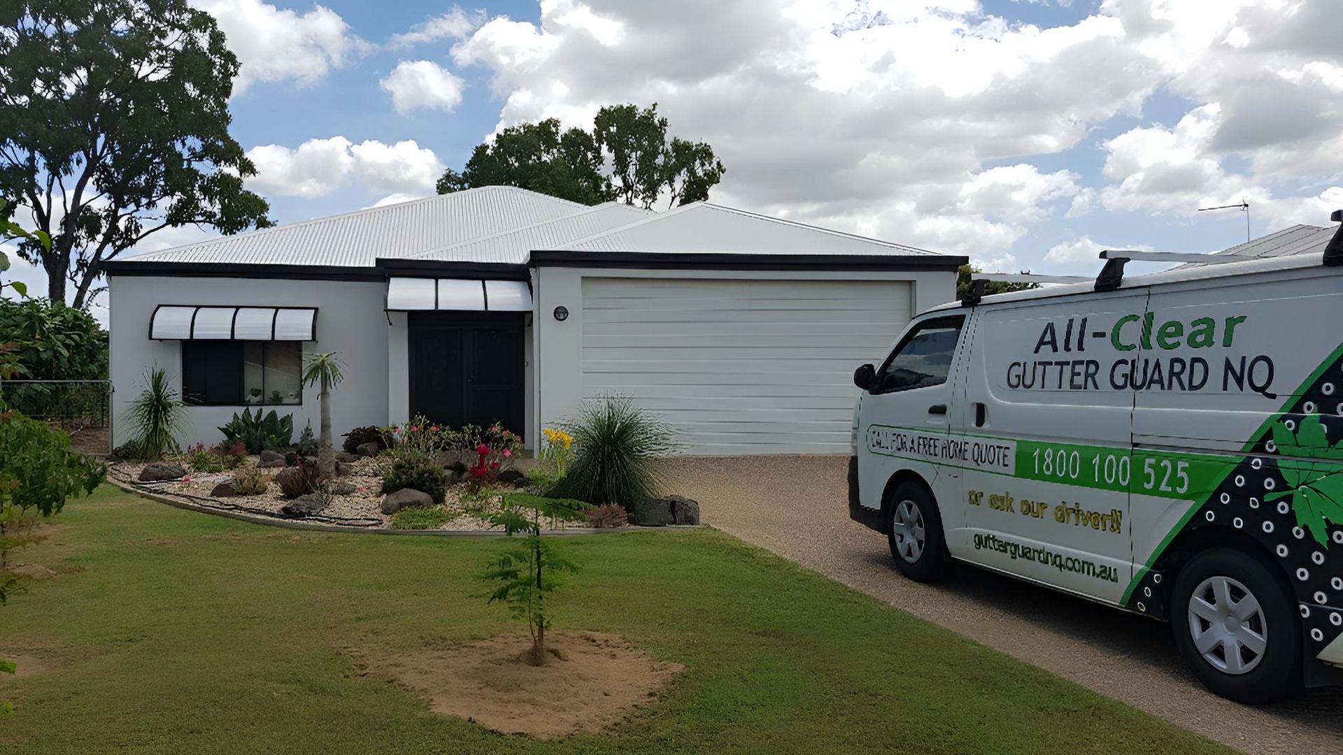 White House with Black Trim and A Van Parked in The Driveway — All-Clear Gutter Guard NQ in Mt Sheridan, QLD