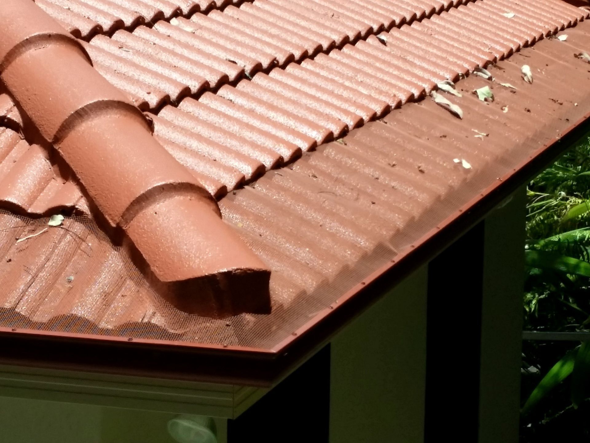 Red Tile Roof with A Matching Gutter and Some Leaves — All-Clear Gutter Guard NQ in Atherton, QLD