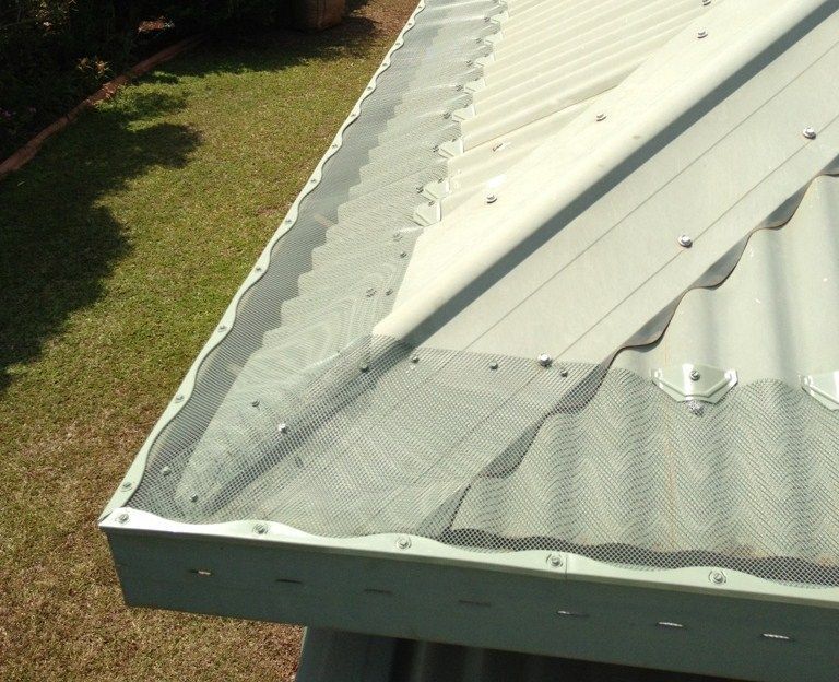 Metal Roof with Gutter Guard Mesh Installed Along the Edge, Protecting Against Debris — All-Clear Gutter Guard NQ in Atherton, QLD