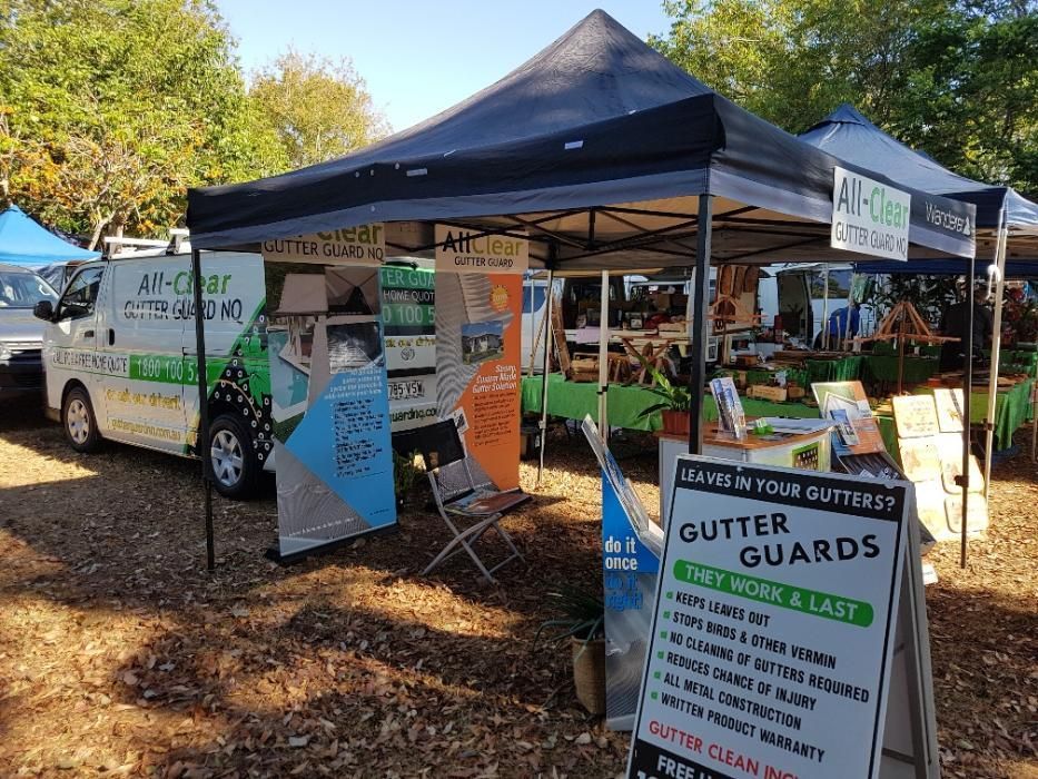 A Van is Parked Next to a Tent and a Sign That Says Gutter Guards — All-Clear Gutter Guard NQ in Cairns, QLD