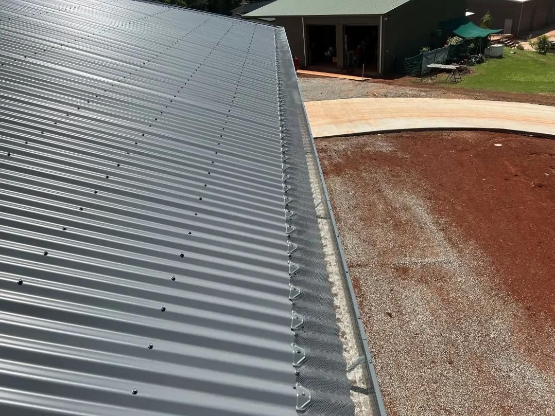 A Close Up of a Roof With a Gutter on It — All-Clear Gutter Guard NQ in Palm Cove, QLD
