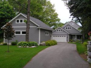 A house with a garage and a driveway leading to it