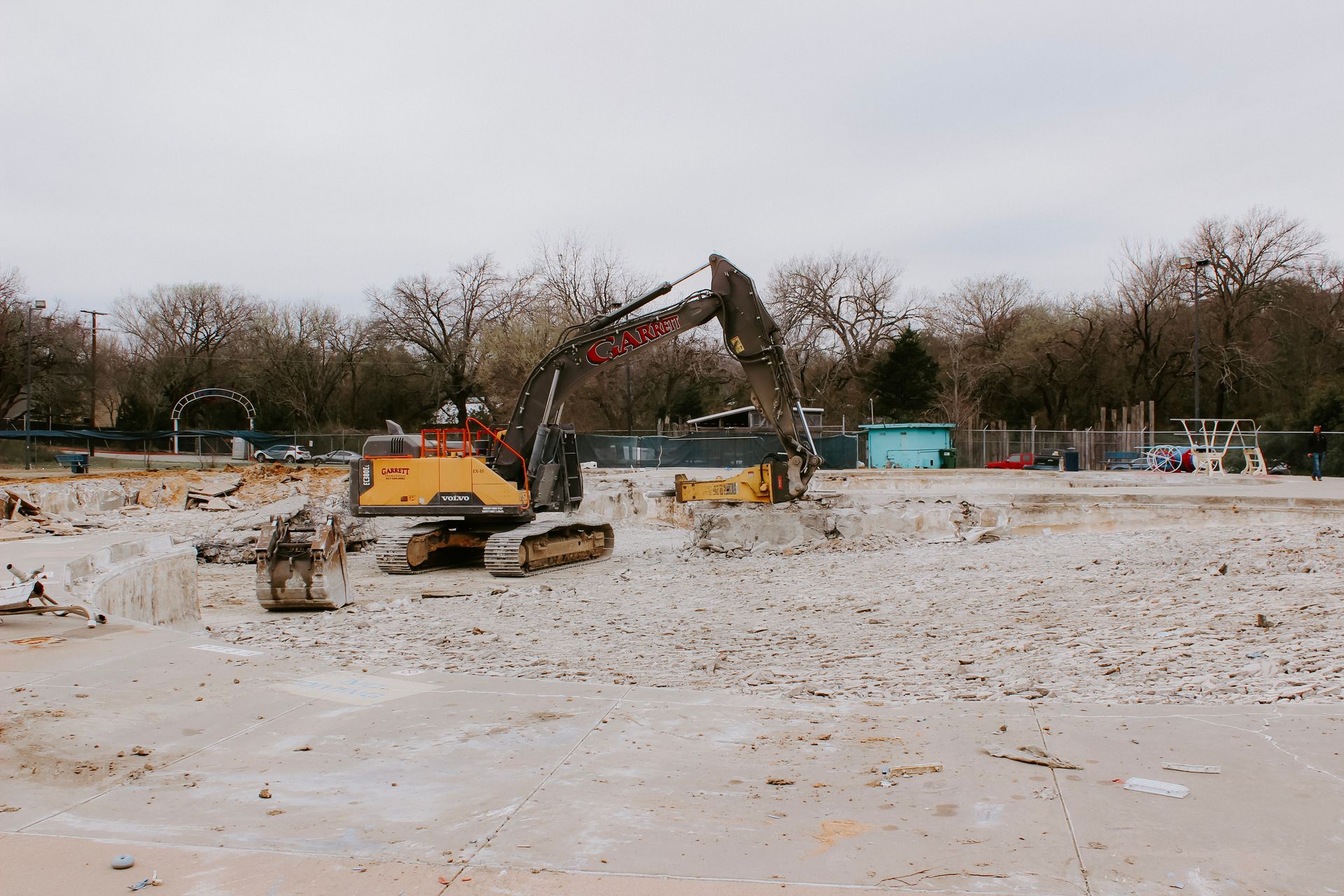 A large excavator is working on a construction site.