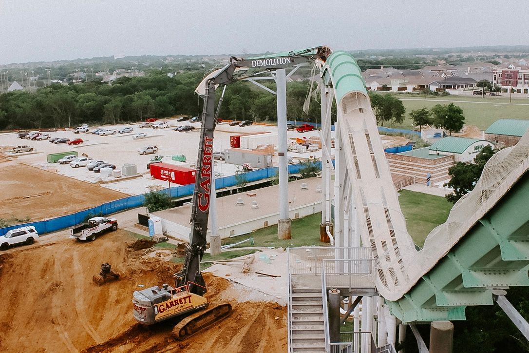An aerial view of a water slide being built at a theme park.