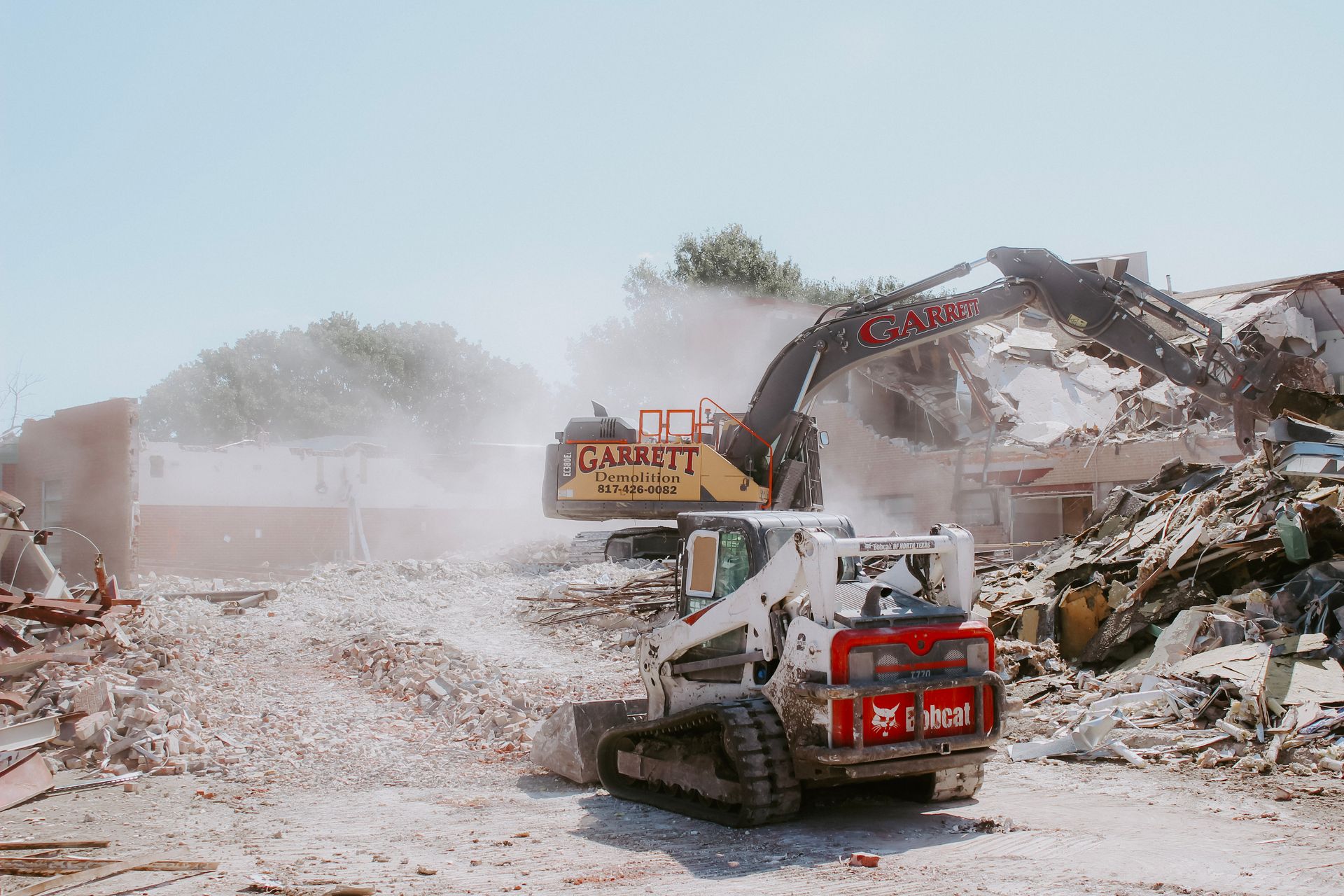 A bulldozer is being used to demolish a building.