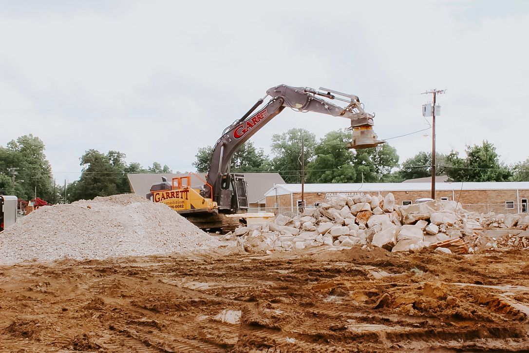 A large excavator is working on a construction site.