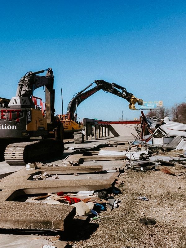 A construction site with a bulldozer and a crane.