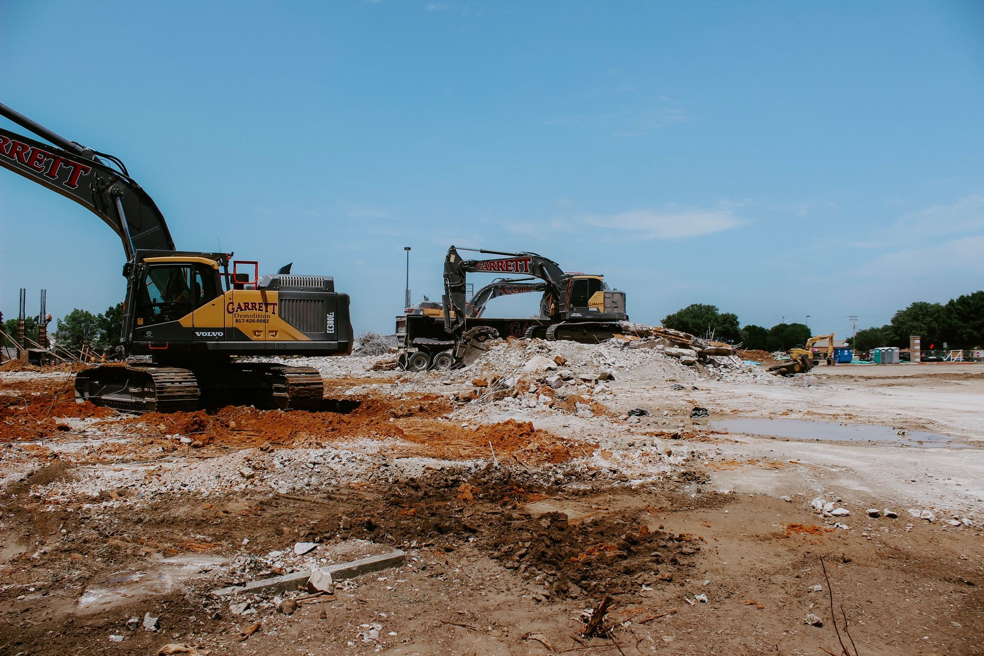 A building is being demolished with a lot of machinery.