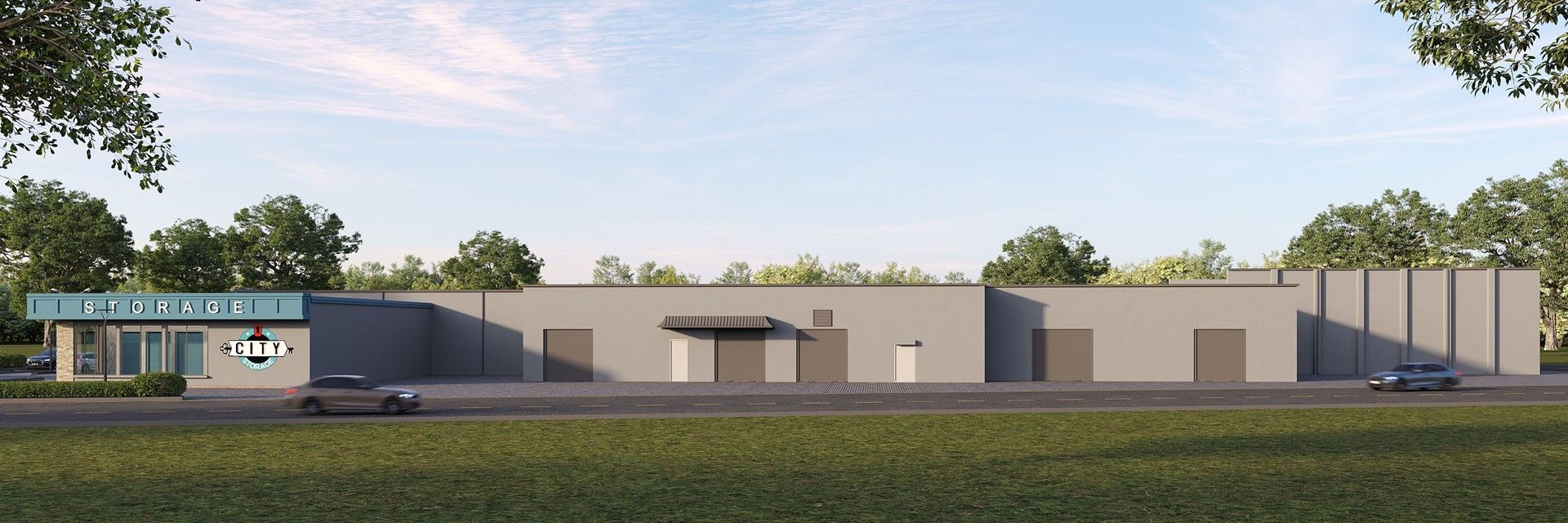 Street view of City Storage facility with modern gray exterior, multiple roll-up doors, and branded office entrance surrounded by trees
