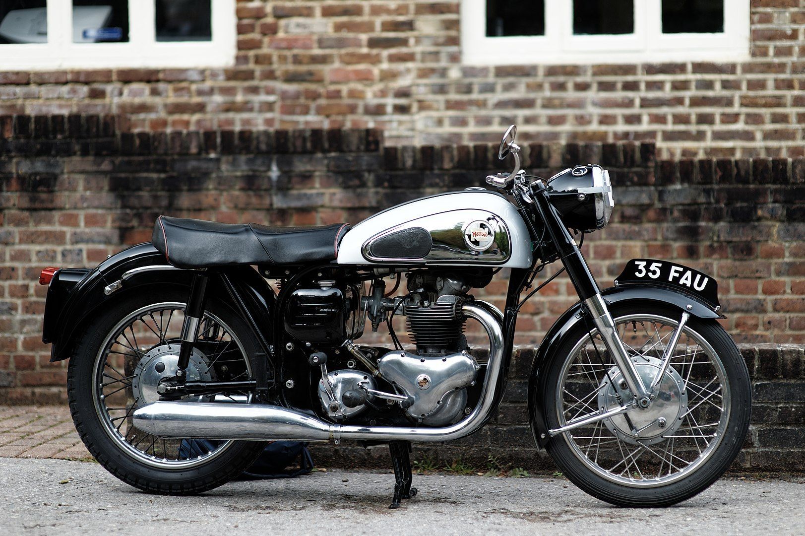 Old motorcycle waiting to be put in storage. 