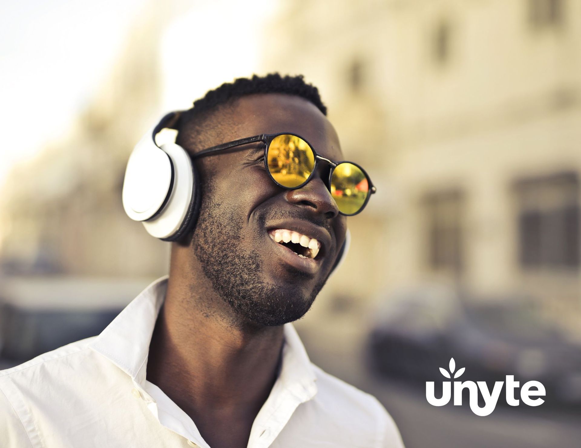 A man wearing headphones and sunglasses is smiling regulating with SSP in Texas