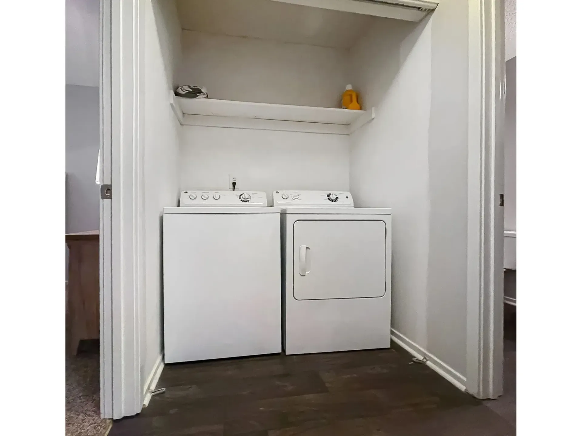 Laundry area with washer and dryer in a closet at Plantation Flats in North Charleston, SC.