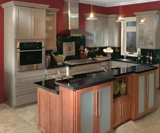 A kitchen with a large island in the middle.