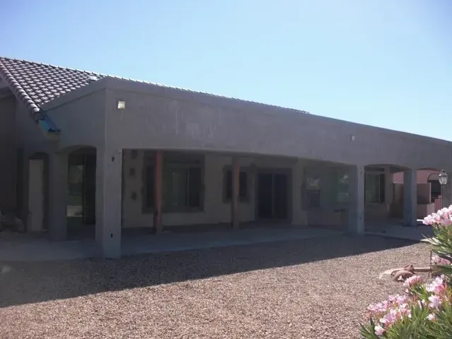 A building with a lot of windows and a blue sky in the background.