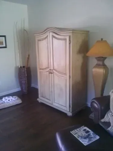 A white cabinet in a room
