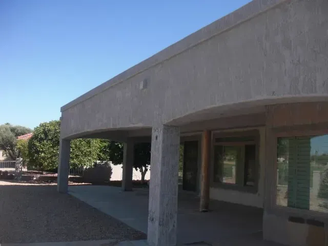 A large building with a blue sky in the background.