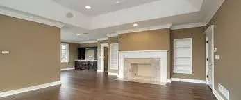 A room with a fireplace and hardwood floors