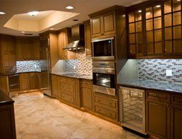 A kitchen with wooden cabinets and stainless steel appliances.