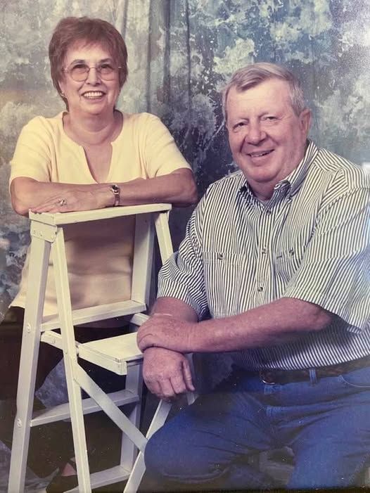A house under construction with a chimney on the roof.