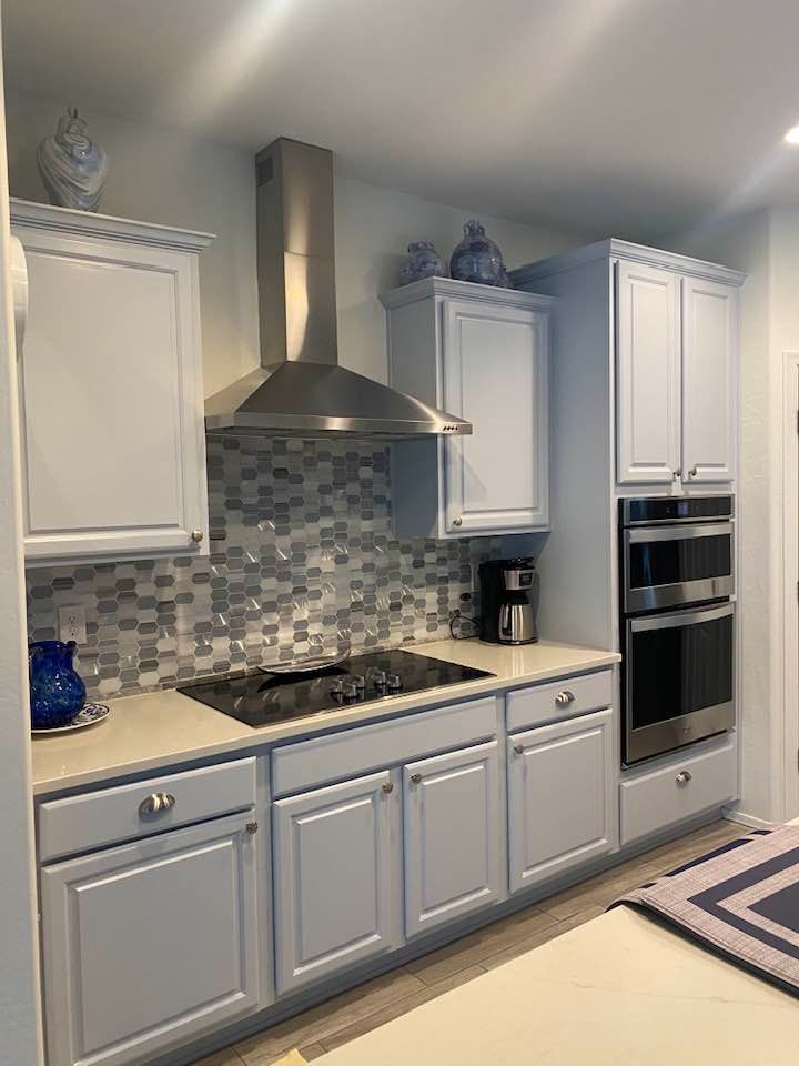 A walk in tub with a door in a bathroom.