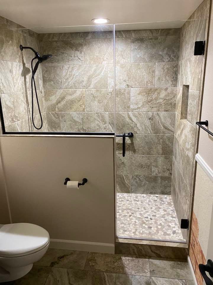 A small house with a cactus in front of it.