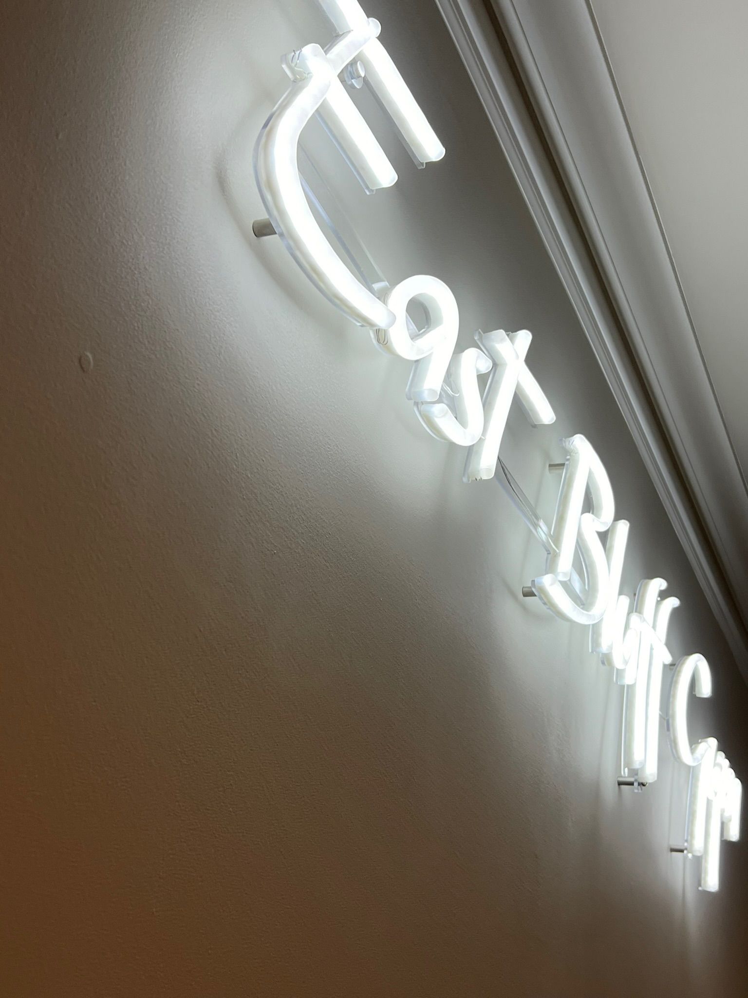 White neon sign reading 