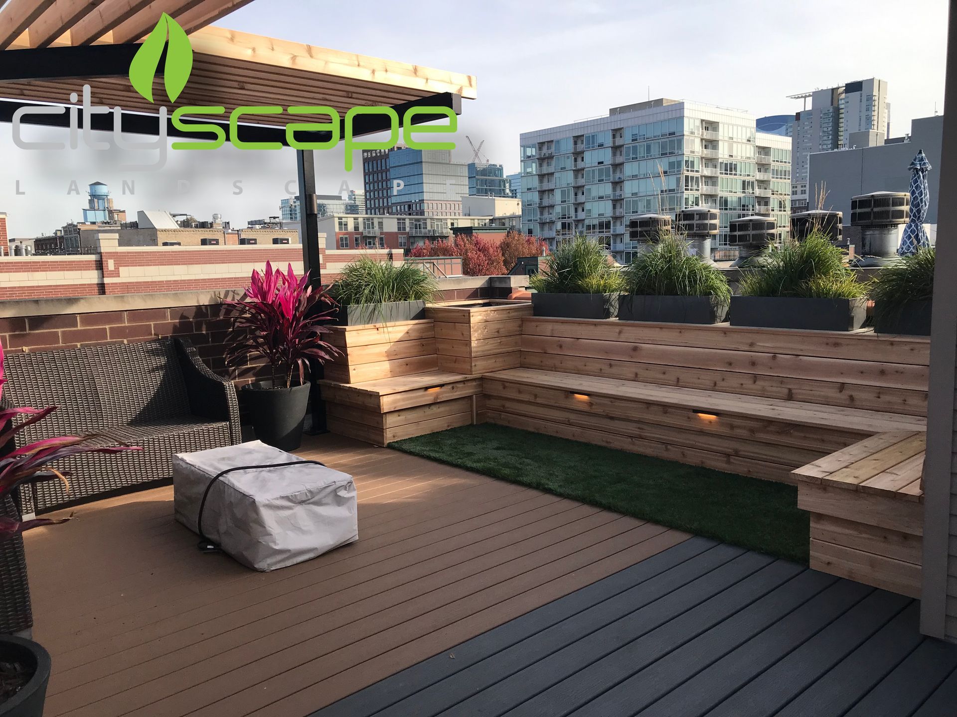 Backyard patio with dining table, gravel pathway, wooden fence, and multi-level deck.