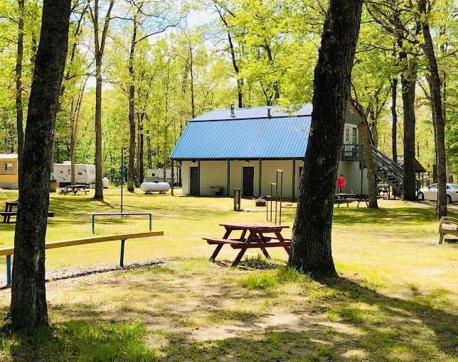 There is a picnic table in the middle of the park.