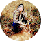 A woman is sitting next to a dog in a circle.