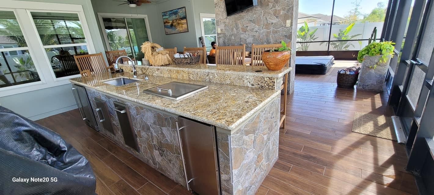 A kitchen with white cabinets and stainless steel appliances.