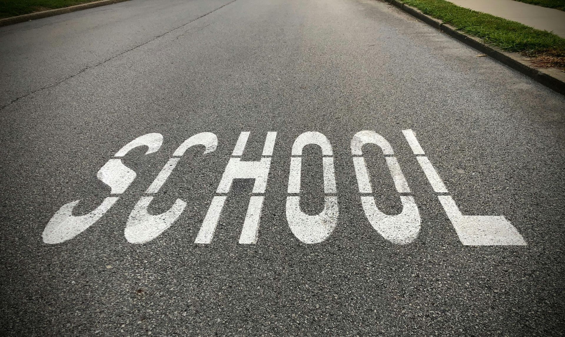The word School painted on the road