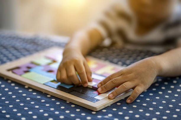 Kid Solving Puzzle — West Allis, WI — First Class Child Care