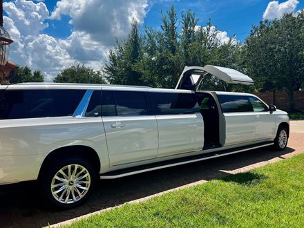 A black limousine is parked on a white background.
